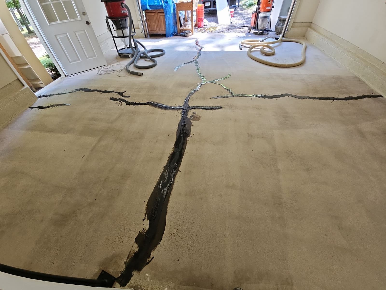 cracked concrete floor in garage - residential garage floor