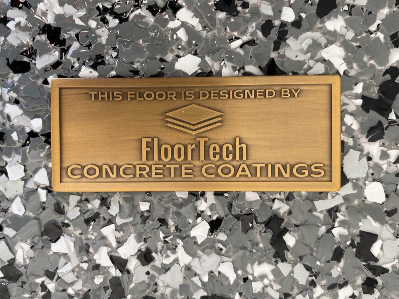 domino flake epoxy garage floor coating with floortech badge