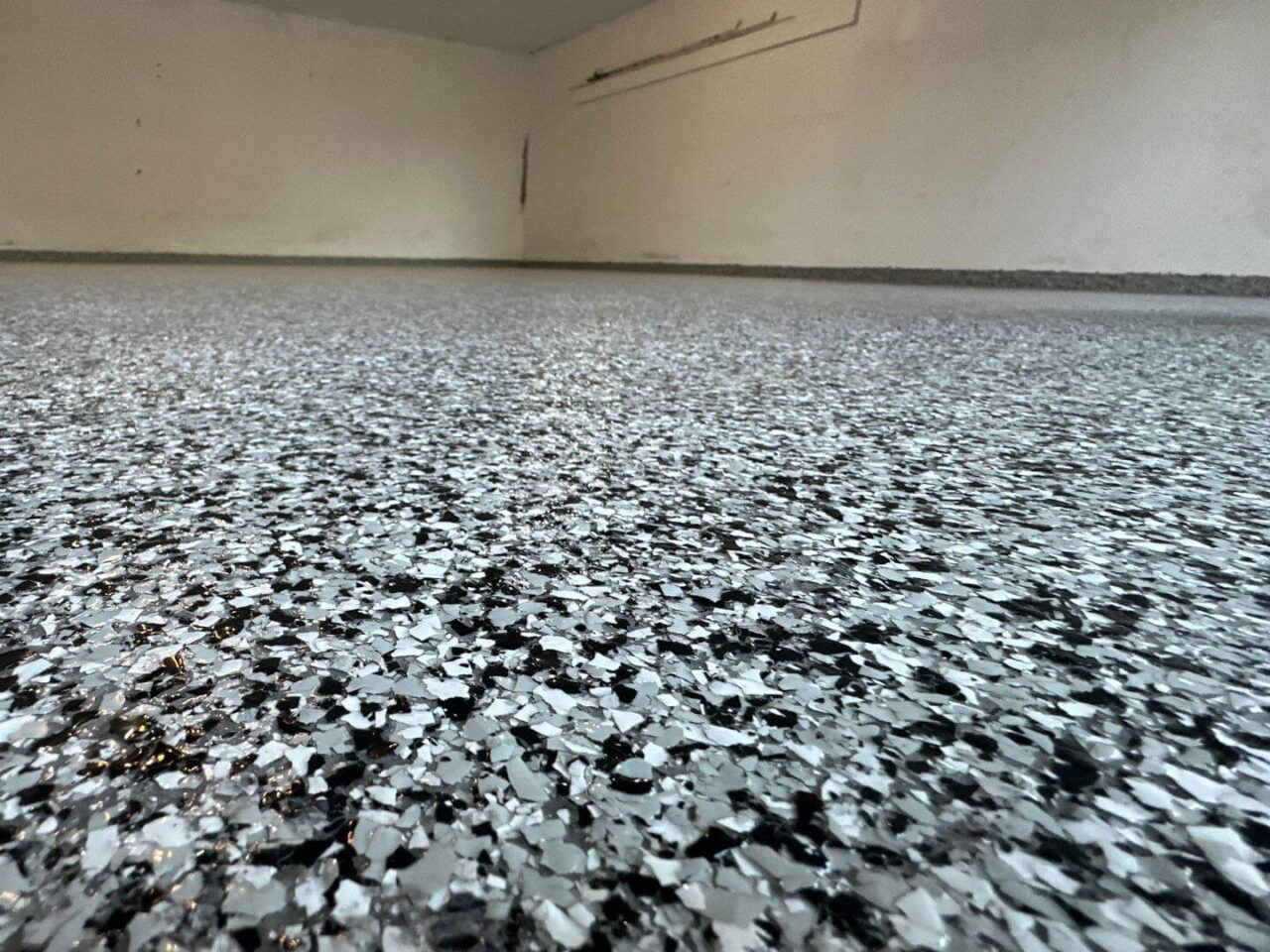 domino flake garage floor epoxy in west Springfield home close up