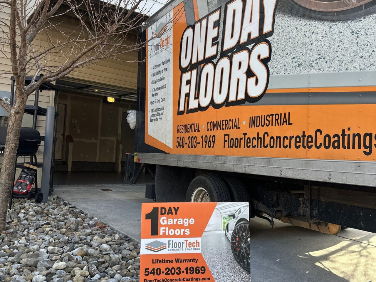 FloorTech truck and sign outside the condo garage during installation day