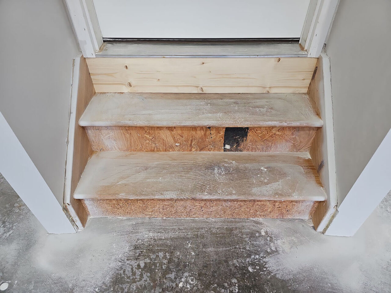 Angle showing overall condition of concrete before grinding and coating.