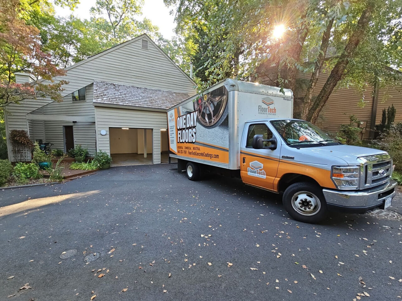 View of the home’s exterior and FloorTech truck parked in the driveway on project day in Reston.
