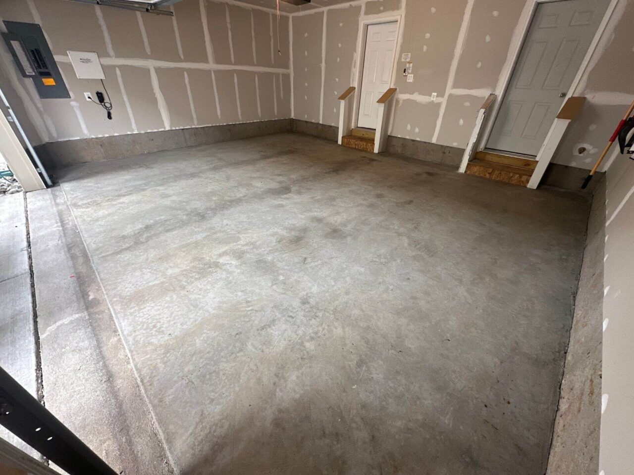 Before shot showing bare concrete floor prior to coating installation