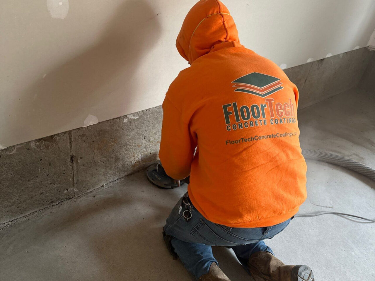 Edge grinding around the perimeter of the garage prior to coating